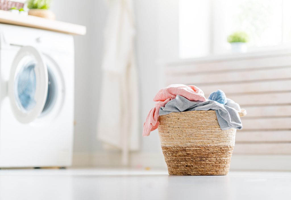 laundry basket with clothes. Laundry is a good opportunity to walk 10,000 steps