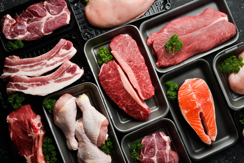 Fresh raw meat, chicken, fish, and pork. Meat is a great way to eat 100 grams of protein per day