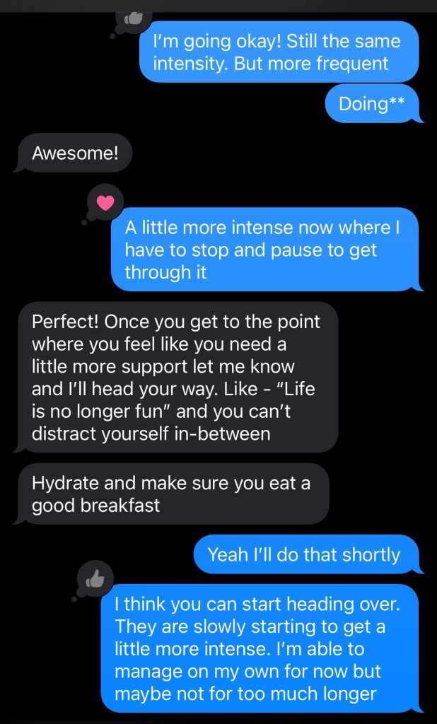 Preethi texting her doula during her home birth